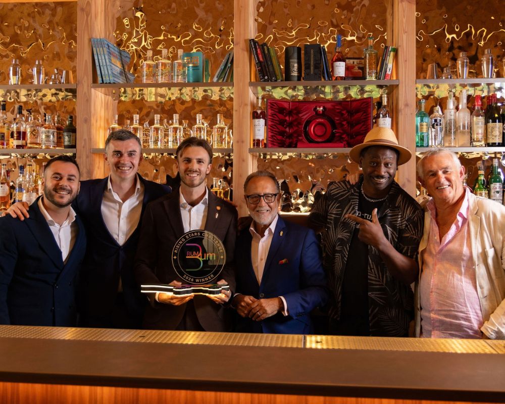 James Lawson holds the 2026 Rising Stars Challenge trophy with the event judges at The Braywood.