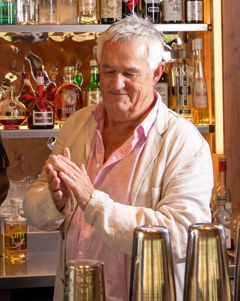 Kevin Snook applauds behind the bar at the Rising Stars Challenge