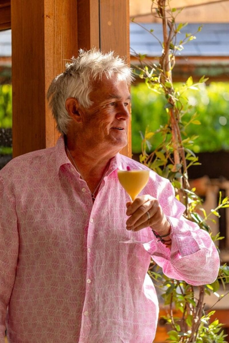 Kevin Snook holding a rum cocktail