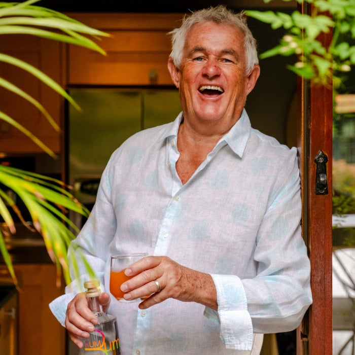 Snooky holding a cocktail and rum bum rum