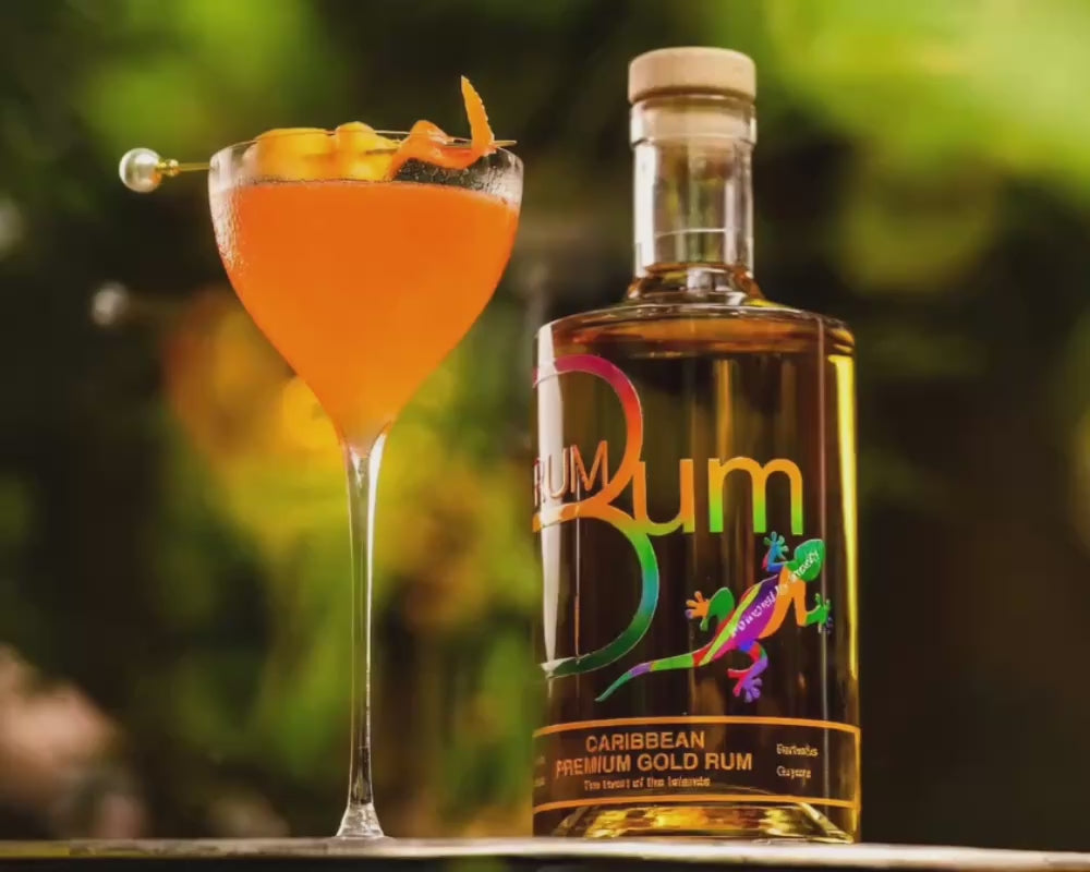 Rum Bum Premium Gold Rum beside an orange cocktail