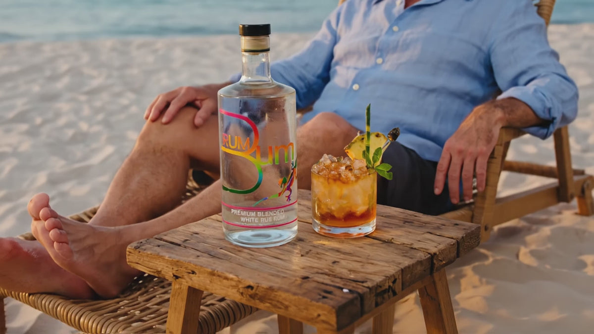 Rum Bum Signature Rum No.1 with a cocktail on the beach