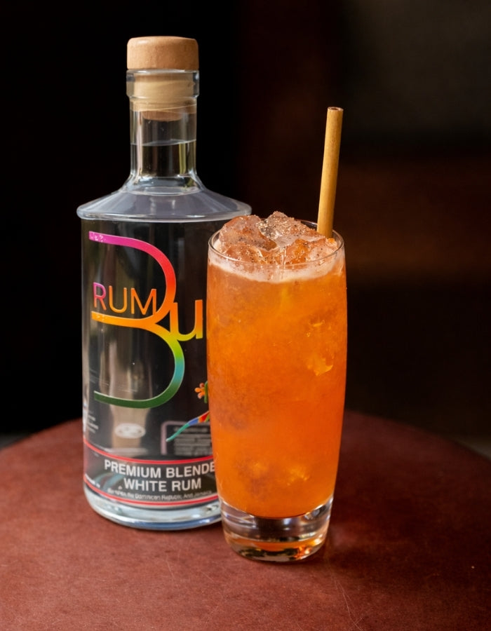 Rum Bum White Rum beside an orange cocktail